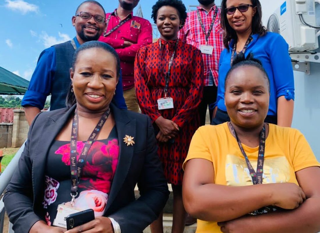 Community-Engagement-and-Bioethics-Associate-Research-Group-lead-Deborah-Nyirenda-in-blue-shirt-with-her-team-members.-Credit-Hendrina-Nkuta-e1648199962781